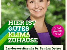 Plakat mit Porträtbild von Sandra Detzer, darauf der Text: Hier ist gutes Klima zuhause.